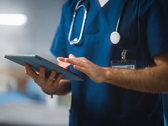Healthcare worker with tablet computer